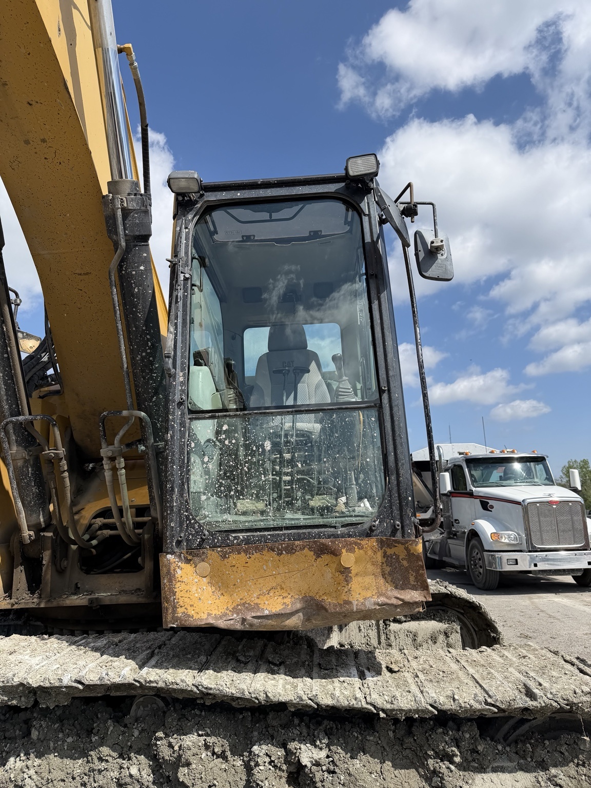 Front cab and windshield on a tracked excavator