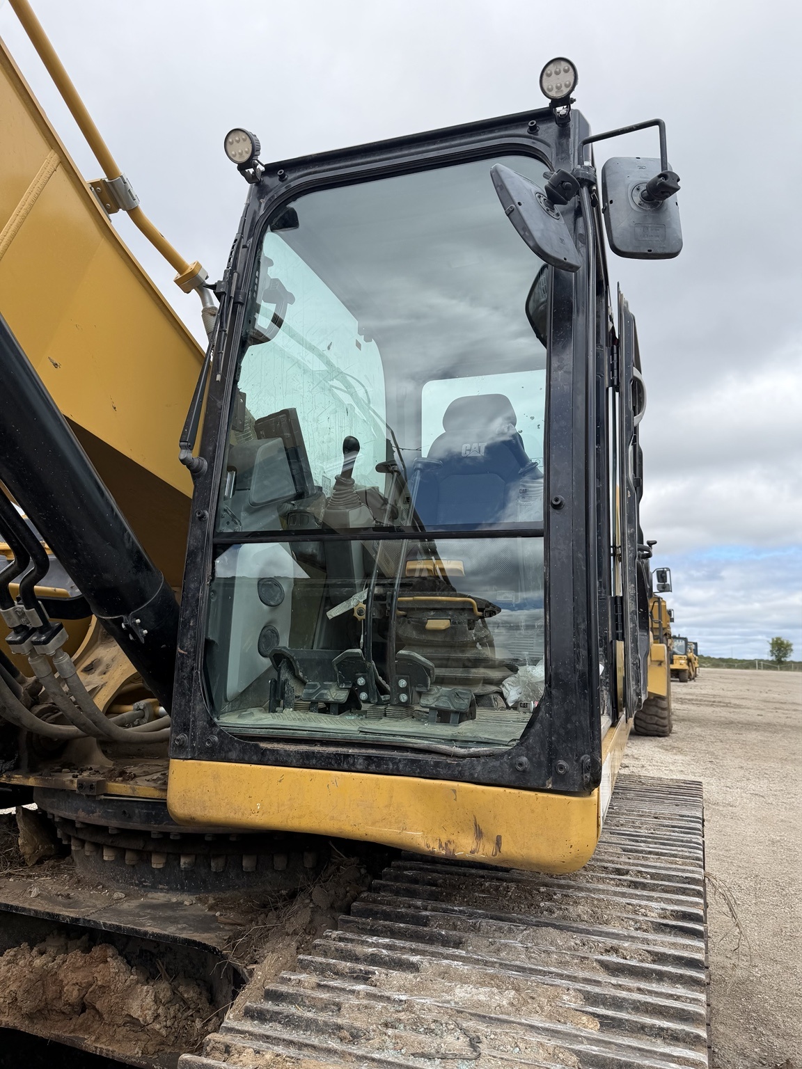 Close view of an excavator cab windshield and frame