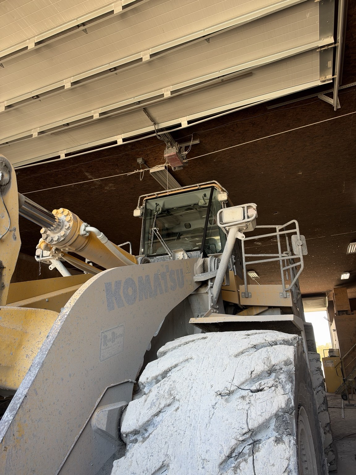 New front center windshield installed on a Komatsu WA600 wheel loader